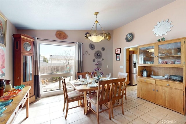 dining area with light tile patterned floors