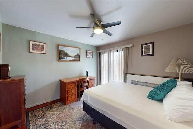 bedroom with baseboards and ceiling fan