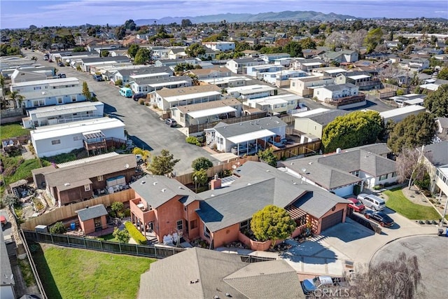 birds eye view of property featuring a mountain view and a residential view