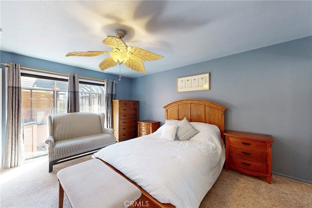 bedroom featuring a ceiling fan, carpet flooring, and access to outside