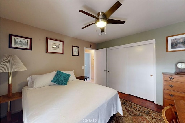 bedroom featuring wood finished floors, a closet, and ceiling fan