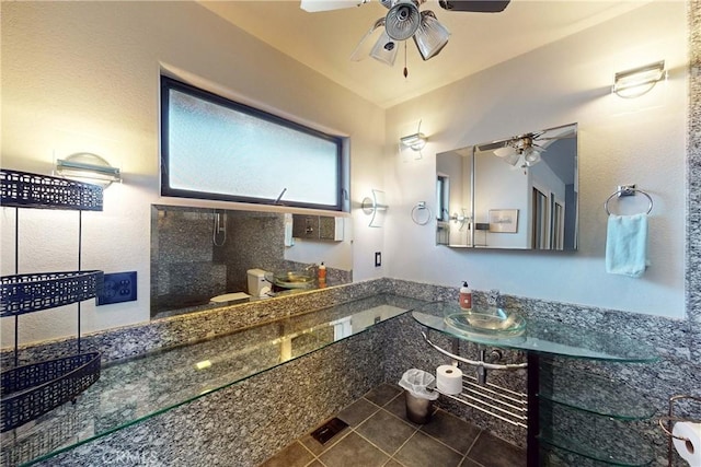 full bathroom featuring tile patterned flooring, toilet, ceiling fan, and a sink