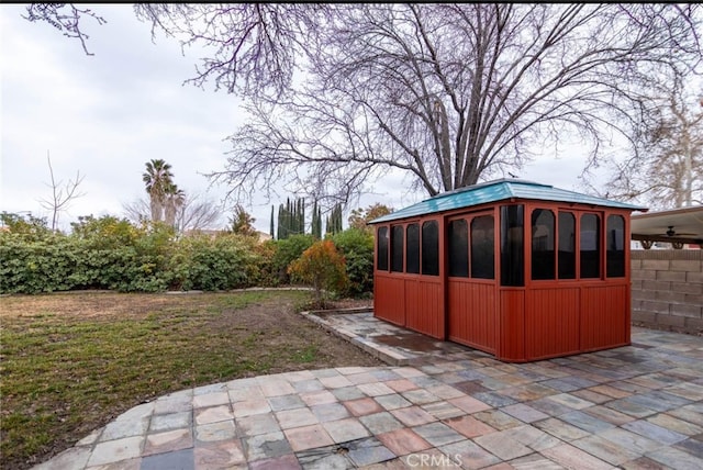 exterior space with an outbuilding and fence