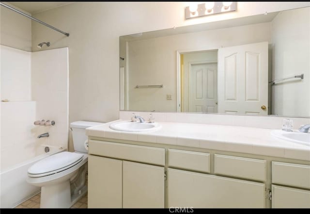 full bathroom with a sink, toilet,  shower combination, and double vanity