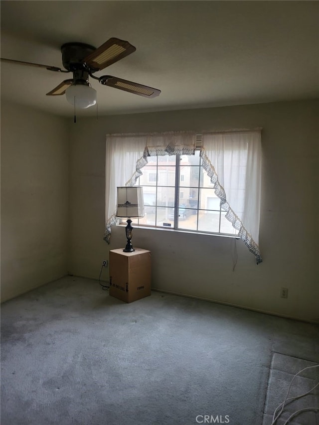 spare room with a ceiling fan