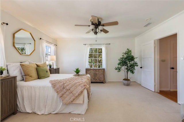 bedroom with visible vents, multiple windows, and crown molding