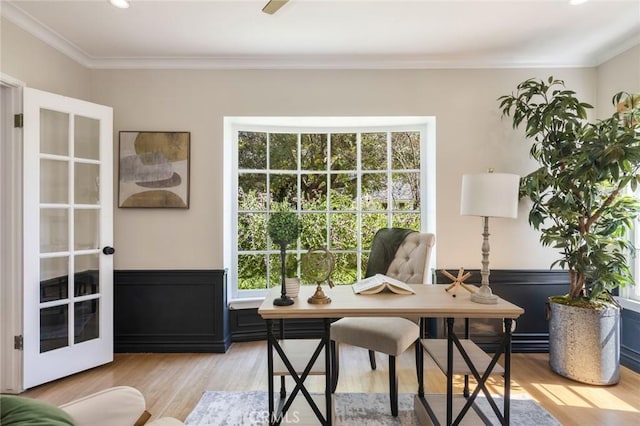 office with light wood finished floors and ornamental molding