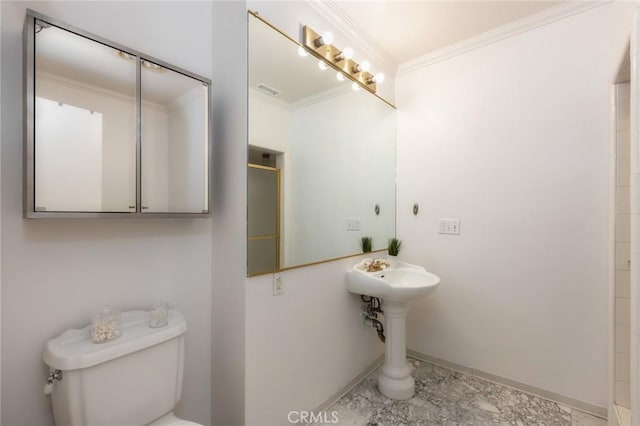 bathroom featuring baseboards, toilet, walk in shower, and ornamental molding