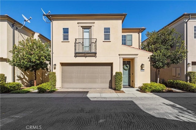 view of front of house featuring stucco siding and an attached garage