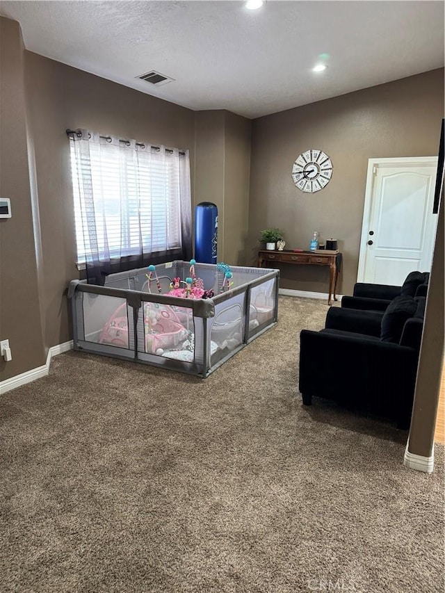 recreation room featuring visible vents, baseboards, carpet floors, recessed lighting, and a textured ceiling