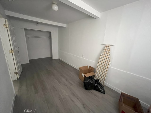 unfurnished bedroom featuring a closet and wood finished floors