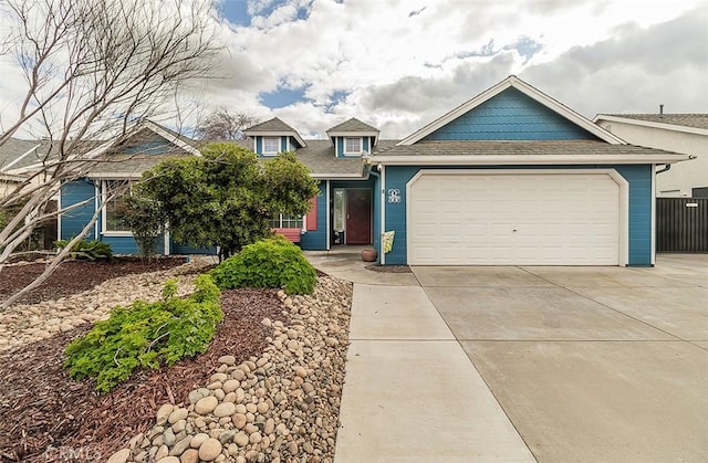 view of front of home with an attached garage and concrete driveway