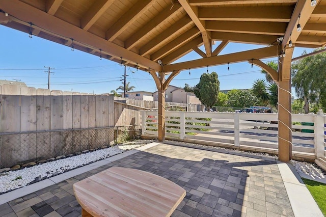 view of patio / terrace featuring fence