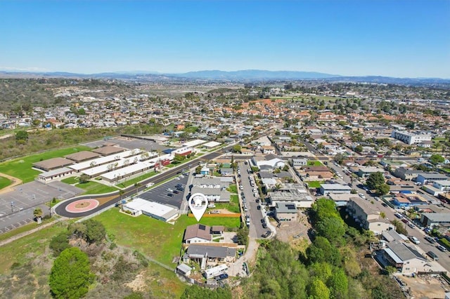 birds eye view of property with a mountain view and a residential view