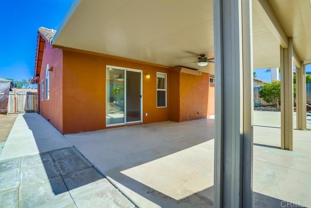 view of patio / terrace featuring ceiling fan and fence