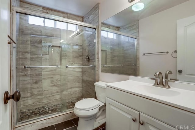 full bathroom with tile patterned flooring, a stall shower, toilet, and vanity