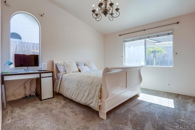 bedroom with carpet flooring, an inviting chandelier, and lofted ceiling