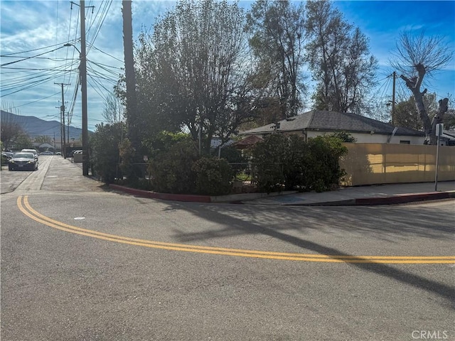 view of road featuring sidewalks and curbs