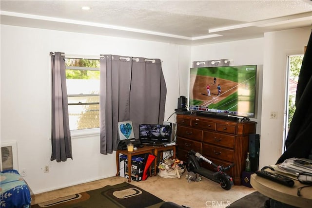 bedroom with carpet and a textured ceiling