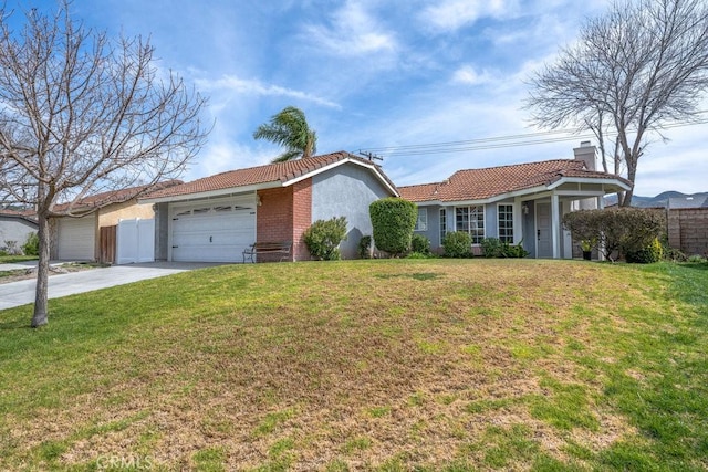 ranch-style house featuring a tile roof, a front yard, a chimney, driveway, and an attached garage