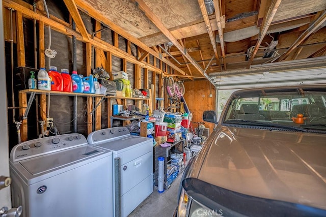 garage with washer and clothes dryer