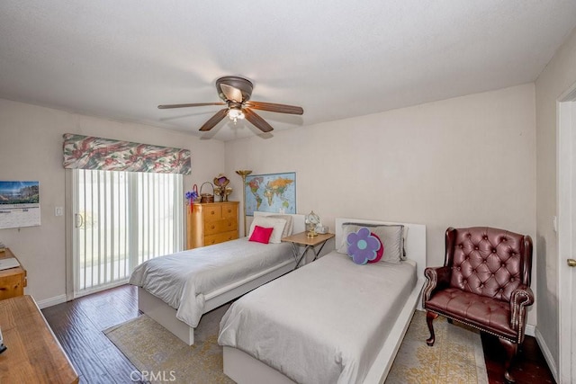 bedroom with baseboards, wood finished floors, a ceiling fan, and access to exterior