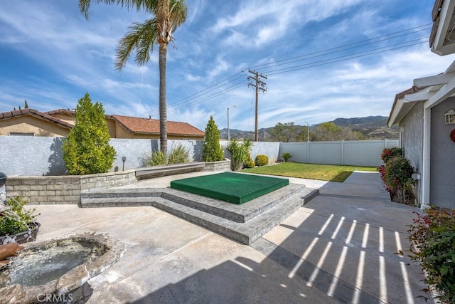 view of patio with a fenced backyard