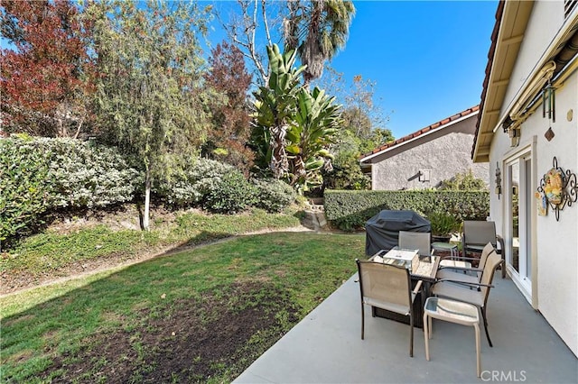 view of patio / terrace with outdoor dining area and area for grilling