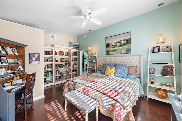 bedroom with visible vents, wood-type flooring, and baseboards