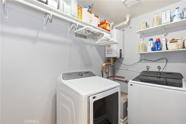 laundry room with water heater, laundry area, and independent washer and dryer