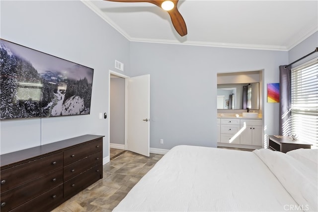 bedroom with visible vents, crown molding, ceiling fan, baseboards, and ensuite bathroom