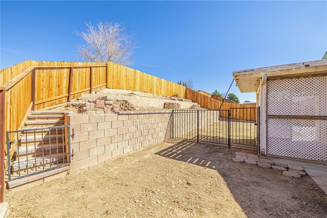 view of yard with a fenced backyard