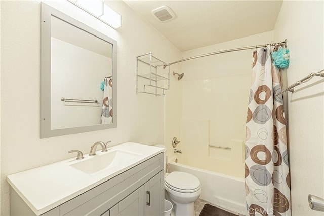 bathroom featuring visible vents, toilet, vanity, and shower / bath combination with curtain