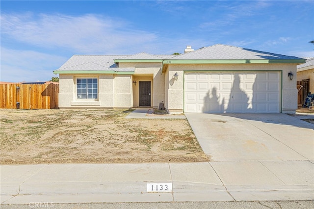 ranch-style home featuring stucco siding, a garage, concrete driveway, and fence