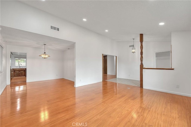12460 Magnolia Ave, Chino, CA 91710 - unfurnished room featuring recessed lighting, a notable chandelier, light wood finished floors, and visible vents