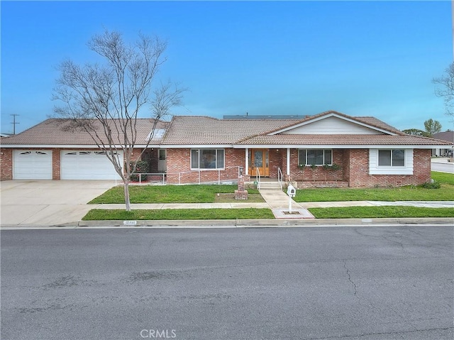 12460 Magnolia Ave, Chino, CA 91710 - ranch-style house featuring a garage, a tiled roof, a front lawn, brick siding, and driveway
