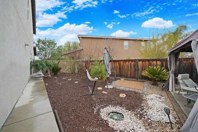 view of yard featuring a fenced backyard and a patio area