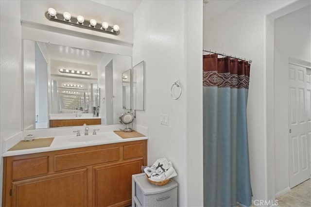 bathroom with vanity and a shower with shower curtain