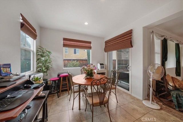 dining space featuring a wealth of natural light and light tile patterned floors