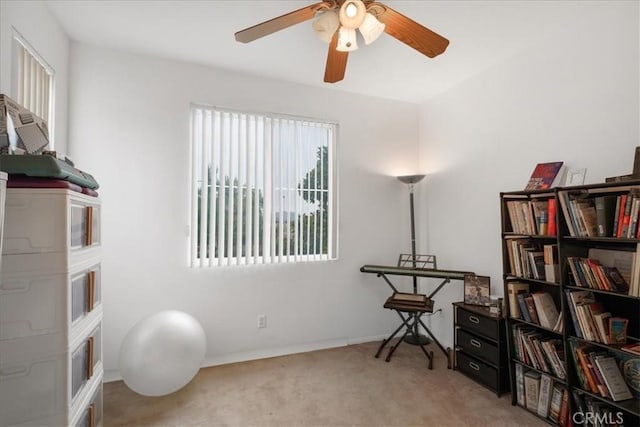 misc room featuring baseboards, carpet floors, and ceiling fan