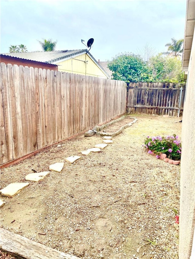 view of yard with a fenced backyard