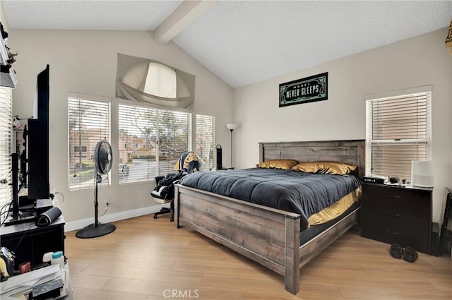 3119 Milano # J, Ontario, CA 91761 - bedroom featuring baseboards, a textured ceiling, vaulted ceiling with beams, and light wood finished floors