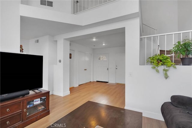 3119 Milano # J, Ontario, CA 91761 - living room featuring visible vents, baseboards, and wood finished floors