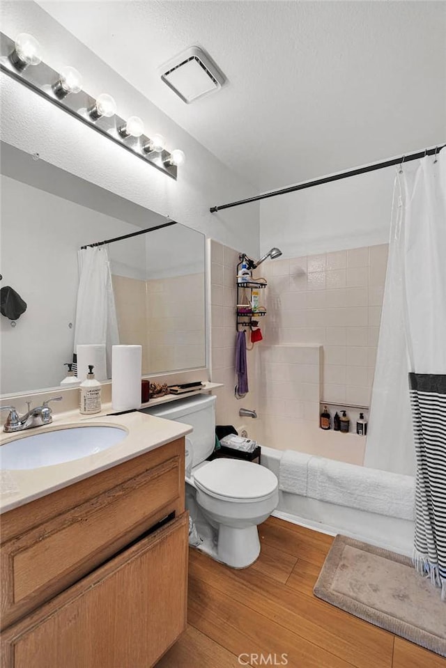 3119 Milano # J, Ontario, CA 91761 - full bath featuring visible vents, toilet, wood finished floors, shower / tub combo, and vanity
