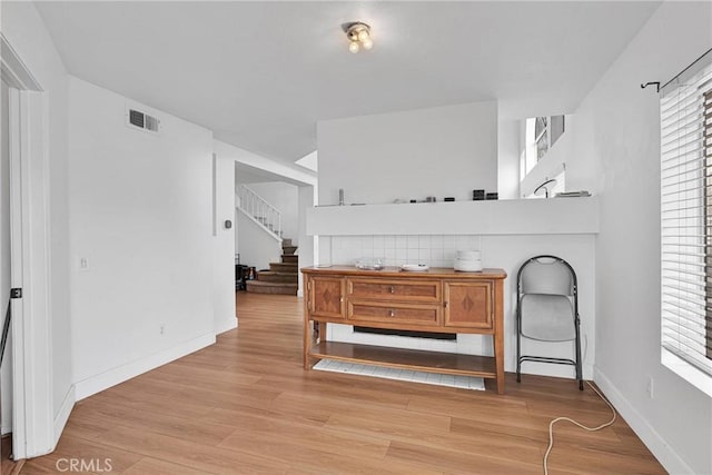 3119 Milano # J, Ontario, CA 91761 - interior space featuring stairway, baseboards, visible vents, and light wood-type flooring