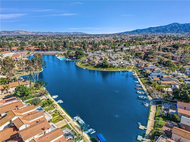 aerial view featuring a residential view and a water and mountain view