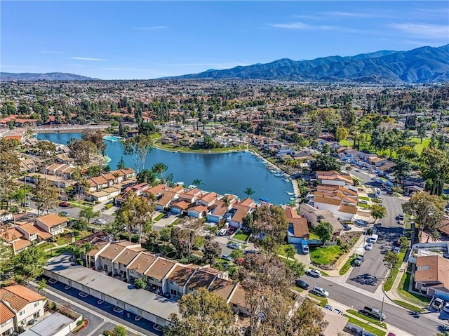 aerial view featuring a residential view and a water and mountain view