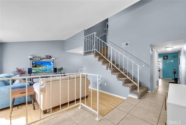 interior space featuring stairs, baseboards, and visible vents