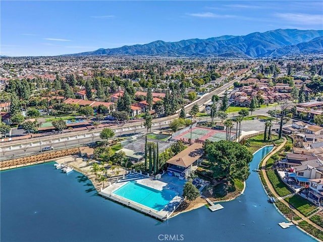 birds eye view of property with a residential view and a water and mountain view