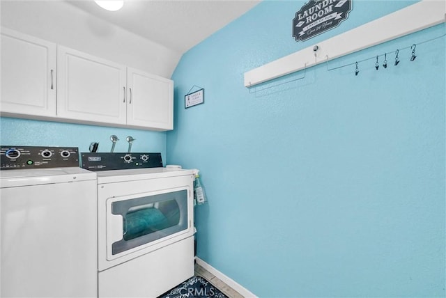 clothes washing area featuring cabinet space, independent washer and dryer, and baseboards